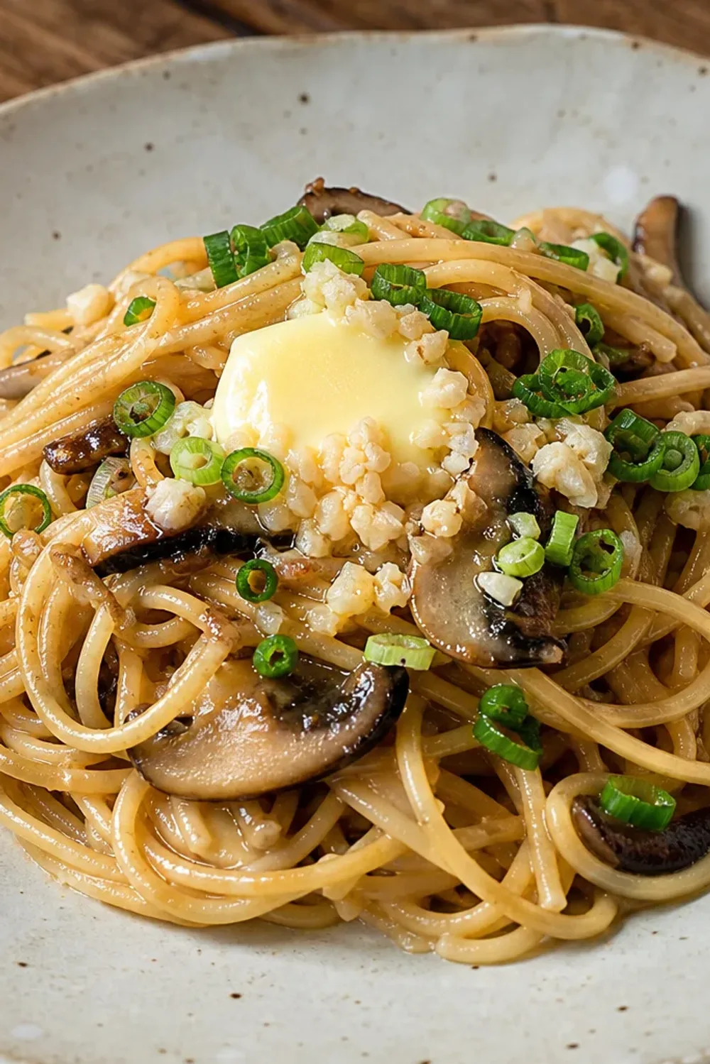 Creamy miso butter pasta topped with sautéed garlic mushrooms and herbs.