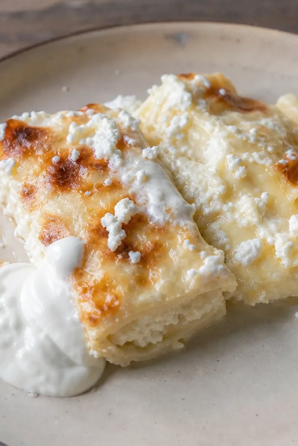 Layered pastry filled with creamy cheese, topped with sour cream and baked to golden perfection.